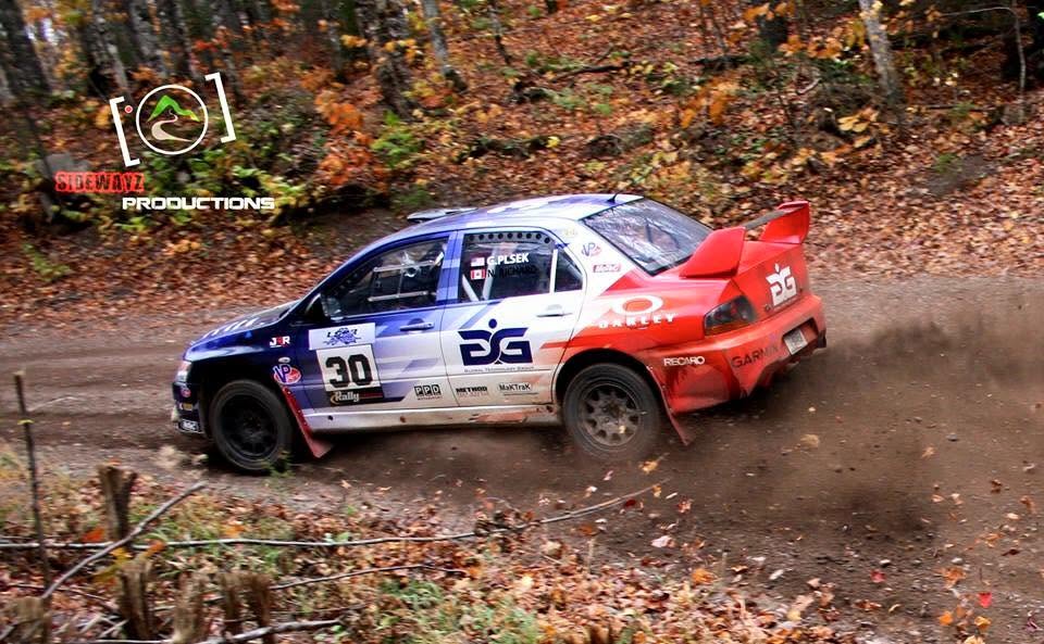 The number 30 Mitsubishi sliding through autumn leaves on a forest stage